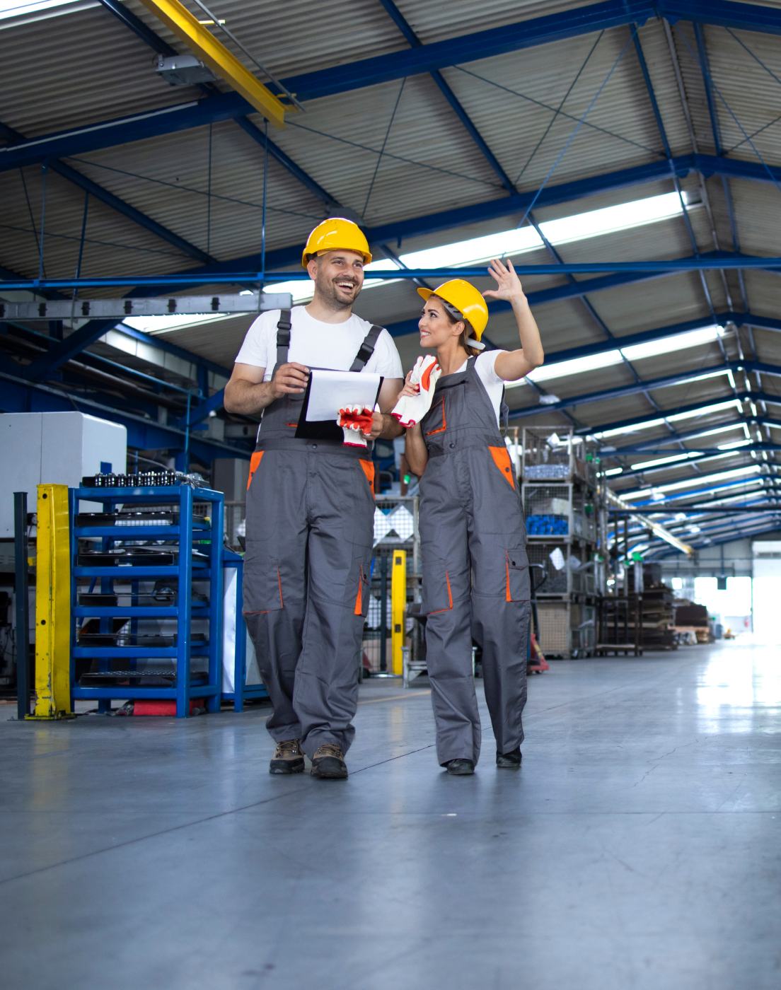 HOLT team members walking the equipment warehouse